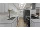 Bright kitchen featuring white cabinets, modern appliances, and stylish finishes at 10408 N 11Th St # 2, Phoenix, AZ 85020