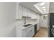Updated kitchen with white cabinets, stainless steel appliances, and sleek countertops at 10408 N 11Th St # 2, Phoenix, AZ 85020