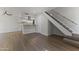 Open living space with a staircase, vinyl flooring, and easy access to the kitchen at 10408 N 11Th St # 2, Phoenix, AZ 85020
