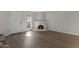 Bright living room boasts a kiva fireplace, wood flooring, and a natural-light-filled entry at 10408 N 11Th St # 2, Phoenix, AZ 85020