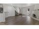 Open-concept layout offers a staircase, a kiva fireplace, and vinyl floors at 10408 N 11Th St # 2, Phoenix, AZ 85020