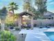 Poolside gazebo with seating area, barbeque and desert landscaping including cacti at 16914 E Britt Ct, Fountain Hills, AZ 85268