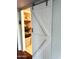 Walk-in closet featuring a sliding barn door and built-in shelves with towels and baskets at 14415 N Boxwood Ln # D, Fountain Hills, AZ 85268