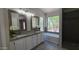 Updated bathroom with granite countertops, dual sinks, and a large shower at 5452 S Pyrite Cir, Gold Canyon, AZ 85118