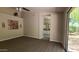 Main bedroom with carpet flooring, ceiling fan, and access to backyard at 5452 S Pyrite Cir, Gold Canyon, AZ 85118