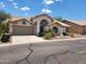 Attractive single-story home with a two-car garage and well-manicured landscaping at 5452 S Pyrite Cir, Gold Canyon, AZ 85118