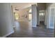 Bright and airy living room with tile flooring and access to other rooms at 5452 S Pyrite Cir, Gold Canyon, AZ 85118
