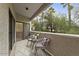 Cozy balcony area with chairs and table overlooking green scenery at 10401 N Saguaro Blvd # 224, Fountain Hills, AZ 85268
