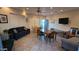 Bright common room featuring tables, seating, and a television, creating a comfortable gathering space at 10401 N Saguaro Blvd # 224, Fountain Hills, AZ 85268