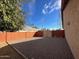 Gravel backyard featuring a block wall fence and open space at 3202 E Decatur St, Mesa, AZ 85213