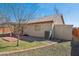 Well-kept backyard featuring rock landscaping, grass and patio with plenty of sunlight at 3202 E Decatur St, Mesa, AZ 85213