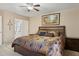 Comfortable bedroom featuring carpet flooring, a ceiling fan, and ample natural light at 3202 E Decatur St, Mesa, AZ 85213