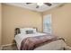 Cozy bedroom with neutral tones, plush carpet, and a comfortable bed at 3202 E Decatur St, Mesa, AZ 85213