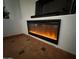 Close-up of a modern electric fireplace with ambient lighting and tile surround at 3202 E Decatur St, Mesa, AZ 85213