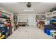 Spacious garage with overhead lighting, shelving, and plenty of room for storage at 3202 E Decatur St, Mesa, AZ 85213