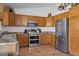 Well-appointed kitchen featuring modern stainless steel appliances and ample wooden cabinetry at 3202 E Decatur St, Mesa, AZ 85213
