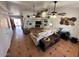 Spacious living room featuring neutral tones, tile flooring, and a vaulted ceiling at 3202 E Decatur St, Mesa, AZ 85213