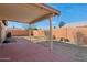 Covered patio featuring brick pavers and a well-maintained fence for privacy at 3202 E Decatur St, Mesa, AZ 85213