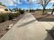 Long concrete sidewalk leading to the home with rock landscaping at 3202 E Decatur St, Mesa, AZ 85213