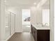 Bright bathroom featuring double sink vanity, tile flooring, and a glass door shower at 3451 E Alexander Dr, San Tan Valley, AZ 85143
