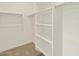A walk-in closet with shelving and clothing racks for ample storage space at 3451 E Alexander Dr, San Tan Valley, AZ 85143