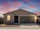 Charming single-story home featuring a two-car garage and desert landscaping at 3451 E Alexander Dr, San Tan Valley, AZ 85143