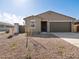 Single-story house showcasing desert landscaping and a neutral color palette at 3451 E Alexander Dr, San Tan Valley, AZ 85143