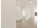 Bright hallway featuring tile flooring and access to multiple rooms at 3451 E Alexander Dr, San Tan Valley, AZ 85143