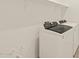 Bright laundry area features a modern white washer and dryer and functional shelving at 3451 E Alexander Dr, San Tan Valley, AZ 85143