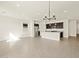 Open-concept living and dining area featuring a kitchen island, stainless steel appliances at 3451 E Alexander Dr, San Tan Valley, AZ 85143