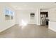 Open-concept living area featuring bright windows and stainless steel appliances at 3451 E Alexander Dr, San Tan Valley, AZ 85143