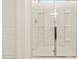 Modern walk-in shower featuring glass doors, chrome fixtures, and a built-in bench at 3451 E Alexander Dr, San Tan Valley, AZ 85143