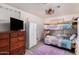 Bedroom with a bunk bed and purple rug at 821 E Roeser Rd, Phoenix, AZ 85040