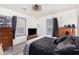 Spacious bedroom with a TV and two dressers at 821 E Roeser Rd, Phoenix, AZ 85040