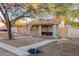 House with a front yard, walkway, and a large tree at 821 E Roeser Rd, Phoenix, AZ 85040