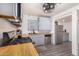 Kitchen with gray cabinets, wood countertops, and gas stove at 821 E Roeser Rd, Phoenix, AZ 85040