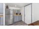 Kitchen features stainless steel refrigerator and gray cabinets at 821 E Roeser Rd, Phoenix, AZ 85040