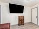 Living room featuring a large TV and vintage radio at 821 E Roeser Rd, Phoenix, AZ 85040