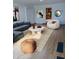 Cozy living room featuring a modern sofa, stylish rug, and unique round coffee table at 3114 E Hazelwood St, Phoenix, AZ 85016