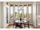 Charming breakfast nook with backyard views and modern lighting, adjacent to the kitchen at 34599 N 99Th Way, Scottsdale, AZ 85262