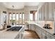 Bright gourmet kitchen with an island, stainless steel appliances, and views of the backyard at 34599 N 99Th Way, Scottsdale, AZ 85262