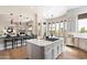 Large kitchen with a center island, bar seating, open to the dining area and living spaces at 34599 N 99Th Way, Scottsdale, AZ 85262