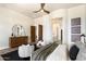 Bright main bedroom featuring hardwood floors and views of the ensuite bathroom at 34599 N 99Th Way, Scottsdale, AZ 85262