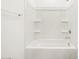 Clean bathroom with a shower/tub combo and shelving at 36933 W La Paz St, Maricopa, AZ 85138