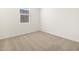 Simple bedroom with carpeted floor and a window with blinds at 36933 W La Paz St, Maricopa, AZ 85138