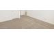 Carpeted bedroom with an open door to another room at 36933 W La Paz St, Maricopa, AZ 85138