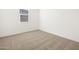 Simple bedroom with carpeted floor and a window at 36933 W La Paz St, Maricopa, AZ 85138
