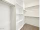 Spacious walk-in closet with ample shelving and hanging space at 36933 W La Paz St, Maricopa, AZ 85138