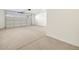 Attached garage with white painted walls and concrete floor at 36933 W La Paz St, Maricopa, AZ 85138