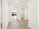 Bright hallway with tile flooring and doors to other rooms at 36933 W La Paz St, Maricopa, AZ 85138
